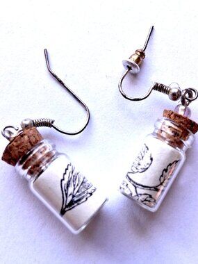 Earrings with a leaf print on a bottle with adornments ear jewelry eardrops